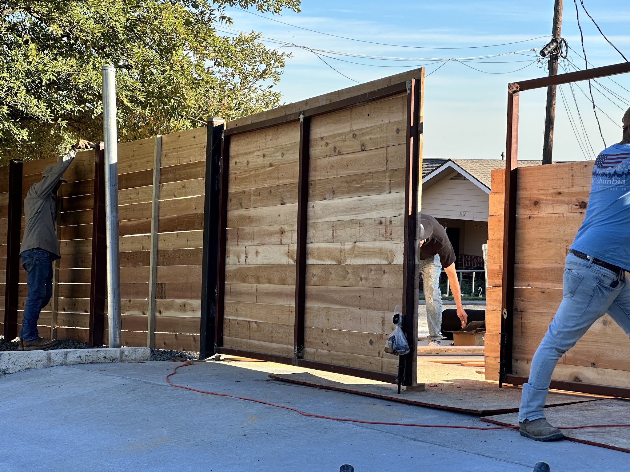 Metal fence installation in progress