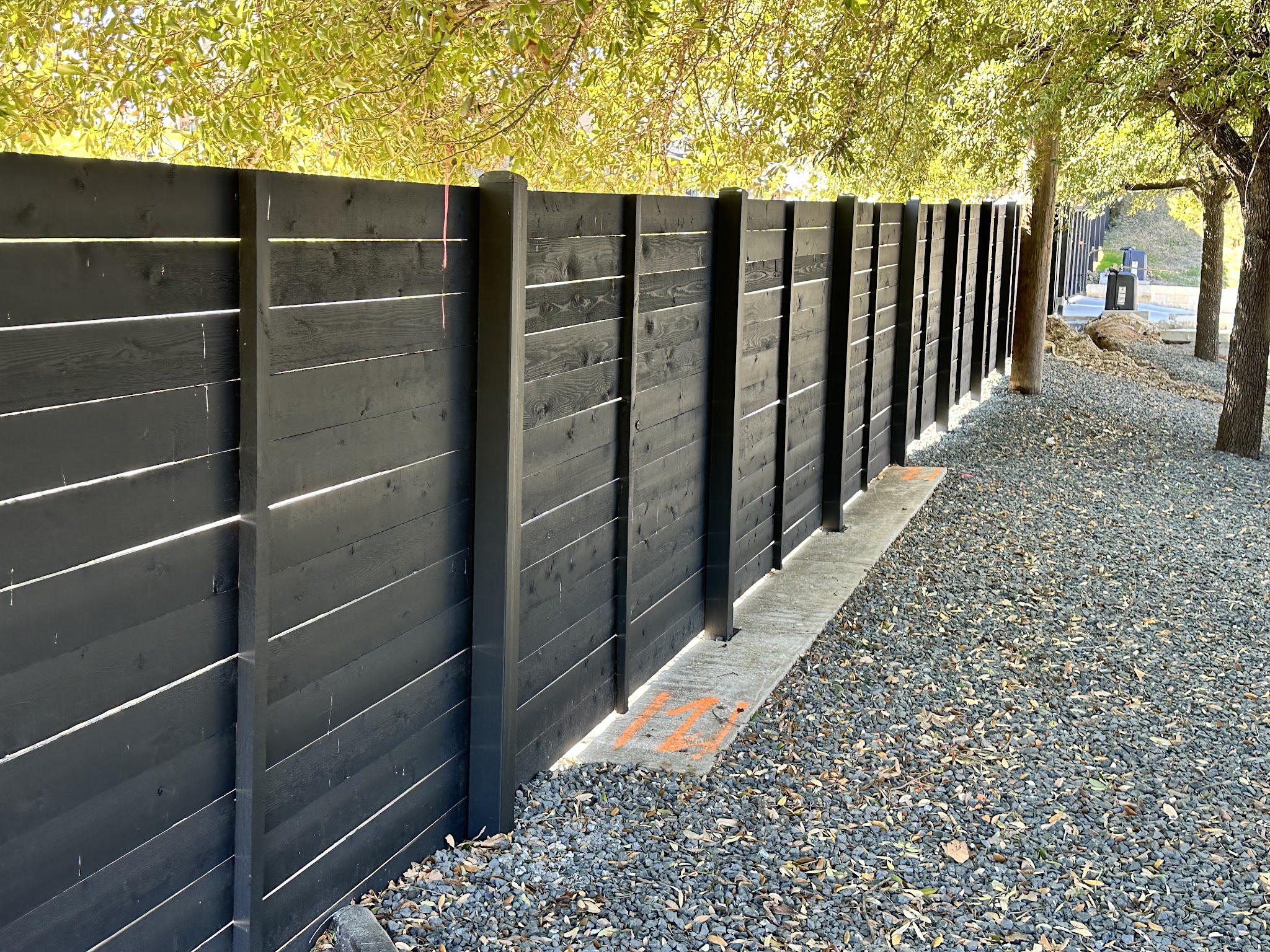 Completed privacy fence project by Quality Home Improvement Experts