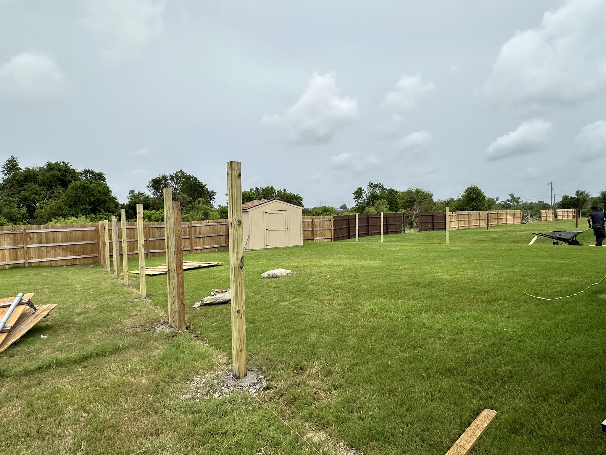 Fence construction with workers